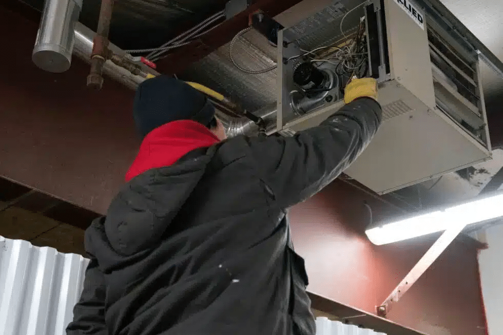 One of our experts doing a heater system replacement.
